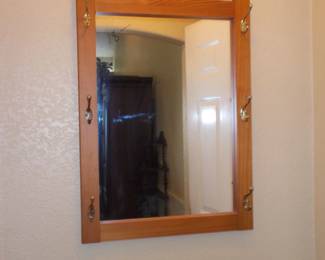 Wall mirror with coat hooks