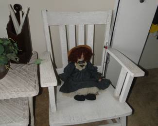 Large oversized rocking chair with ragdoll