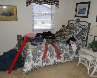 So this twin wrought iron bed does need to be cleared off, but its a twin bed, with wrought iron head and foot boards