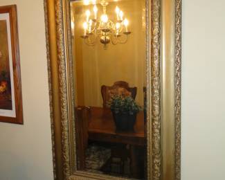 Beveled mirror on the wall, that is one intricate frame you have there...............looking good