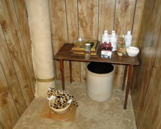 Rolled up rug, and large crock