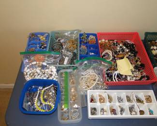 Jewelry, lots of great costume jewelry, stored in bins, and ice cube trays, because, why not