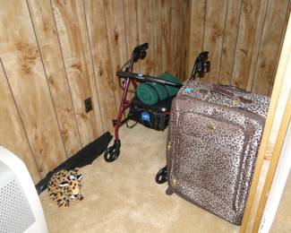 You will see animal print fabric all over this Estate Sale, including this piece of luggage.  The walker is burgundy and black