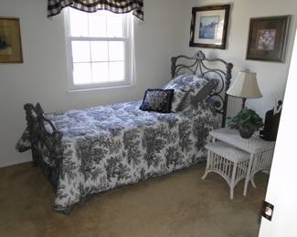 Wrought iron twin bed with all the trimmings, and plenty of outstanding wicker pieces too