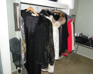 One closet, filled with women's outdoor coats