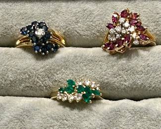 14k gold, rubies, diamonds , sapphires and emeralds
