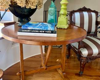 French Wine Table,  the circular hinged top on a trestle form base.