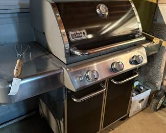 Practically new Weber gas grill with tank