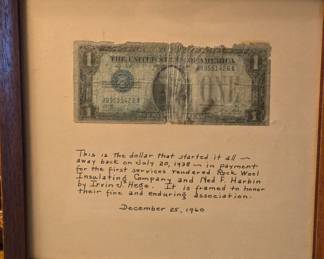 Framed $1 bill , 1st bill earned by Rock Wall Insulating Co in 1938