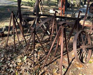 primitive industrial iron metal stands, wheels, implements, tools