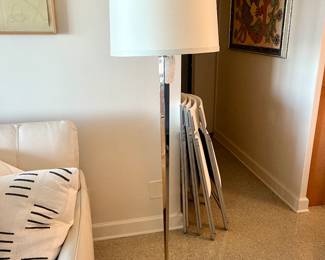 Pair of Barbara Barry for Boyd Lighting Floor Lamps. Round drum form linen fabric shades with partially covered tops, tapered hexagonal silver metal bodies on round feet. 'BOYD LIGHTING' label to undersides with additional labels. {Approximate dimensions: 62" high x 20" diameter.}. 
