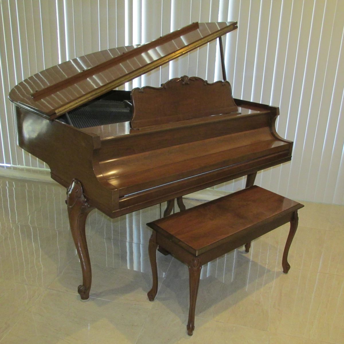 Beautiful Howard (Baldwin) Satin Walnut Baby Grand Piano w/bench, EXCELLENT condition!  The homeowner has taken extraordinary care and has had it tuned and maintained every six months.  Priced at $1,000 / OBO.  Please contact us for a viewing. 