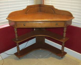 Sweet petite corner desk.