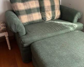 Oversized chair with twin foldout bed.