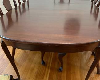 C1 - $495. Craftique Solid Wood Table. Measures 56" long x 42" wide x 30" tall. Has table pad & 3 leaves that add 12" each. Includes 1 arm chair 5 regular chairs. Very sturdy and in good condition 