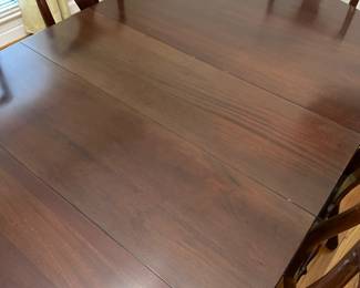 C1 - $495. Craftique Solid Wood Table. Measures 56" long x 42" wide x 30" tall. Has table pad & 3 leaves that add 12" each. Includes 1 arm chair 5 regular chairs. Very sturdy and in good condition 