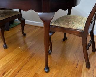 C1 - $495. Craftique Solid Wood Table. Measures 56" long x 42" wide x 30" tall. Has table pad & 3 leaves that add 12" each. Includes 1 arm chair 5 regular chairs. Very sturdy and in good condition 