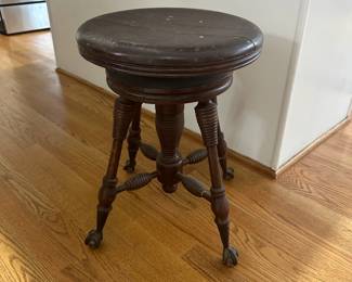 C12 - $50 - Antique Piano Stool with Glass feet. Seat is 14" round - height is adjustable. 