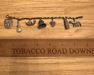 C56 - $35 - 800 Silver Charm Bracelet. 43.4 grams. 