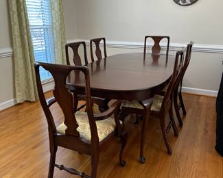 C1 - $495. Craftique Solid Wood Table & Chairs. Measures 56" long x 42" wide x 30" tall. Has table pad & 3 leaves that add 12" each. Includes 1 arm chair 5 regular chairs. Very sturdy and in good condition. 