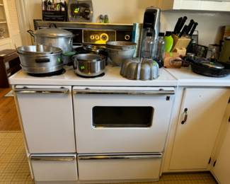 Great vintage stove for sale. Tested briefly oven and range top heat. Note the left side is a storage/ warming unit.