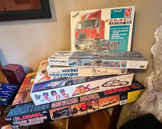 AMT GMC Astro 95 Truck Tractor 1:25 Scale Plastic Model Kit - In Original Box,  1975 Revell USS North Carolina Battleship Showboat Model Kit - In Original Box, Entex Wankel Mazda Rotary Engine Motorized Model - In Original Box,  1975 AFX Aurora Jackie Stewart Super Speedway – In Original Box,  Lionel Iron Horse Freight Train Set