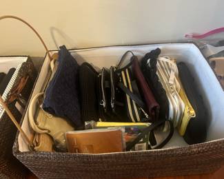 huge assortment of clutches, wallets, coin purses