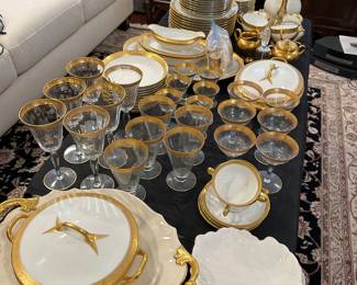 gold rimmed wine and serving glasses