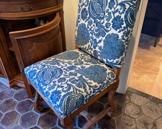 Blue & White upholstered dining chairs with carved wood accents from The Merchandise Mart; (6 armless, 2 arm)