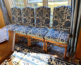Blue & White upholstered dining chairs with carved wood accents from The Merchandise Mart; (6 armless, 2 arm)