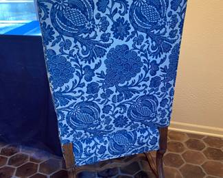 Blue & White upholstered dining chairs with carved wood accents from The Merchandise Mart; (6 armless, 2 arm)