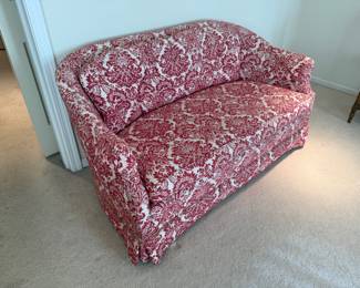 Vintage upholstered red/white damask patterned small sofa