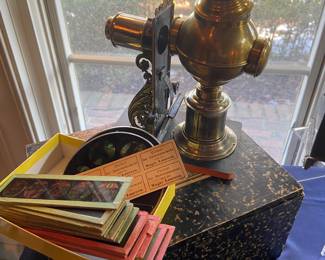 Antique magic lantern projector with glass slides