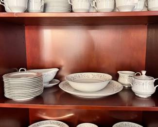 A set of silver- trimmed tableware, made in Japan. 