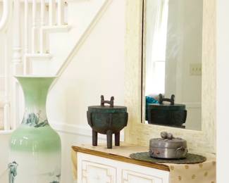 Mother pearl mirror and white wood table. 