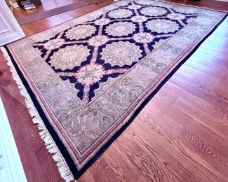Beautiful Tan, Black, Green and Taupe Area Rug