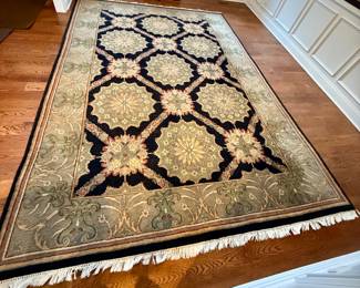 Beautiful Tan, Black, Green and Taupe Area Rug