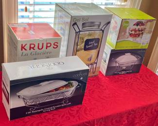 Unused in original boxes appliances and serving containers.