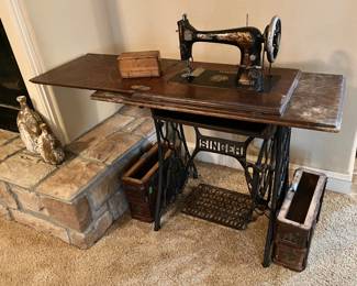 Antique Singer Treadle Sewing Machine needing a little putting back together, but appears complete.