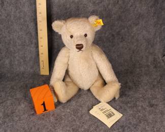 Lot 1:  Sale:  Now $100.  Was $150.  Steiff 028724, 9" when seated. Tagged