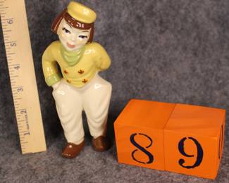 Lot 89: Sale $10.  Was $18.  Ceramic Arts Studios boy with yellow jacket