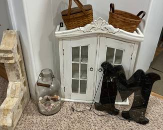 Rustic farmhouse wall curio/medicine cabinet; cute baskets; fun decor throughout the house.