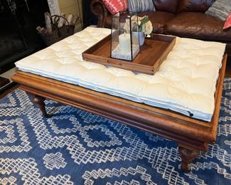Hand-made coffee table in solid cherry. Has a glass top underneath cushion.