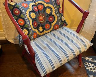 One of two matching spindle-back chairs, cushion included.