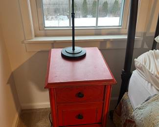 Second of two matching chabby chic three-drawer nightstands painted red (see previous photo); second of two matching table lamps.