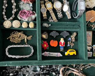 Costume jewelry and wrist watches.