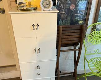 Jewelry armoire; fun quality decor throughout.