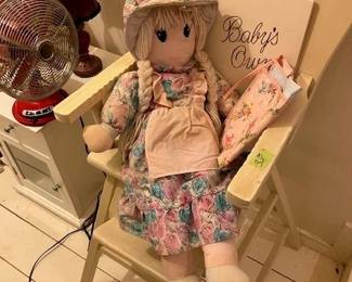 Antique high chair, doll, and baby book