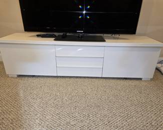 Low white Formica TV stand (TV not for sale)