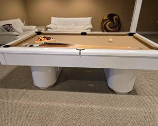 Beautiful modern pool table in great condition! Comes with all the pool sticks, balls, ping ping table with accessories